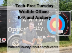 Wildlife Officer Keller, K9 Scout, and archery trailer